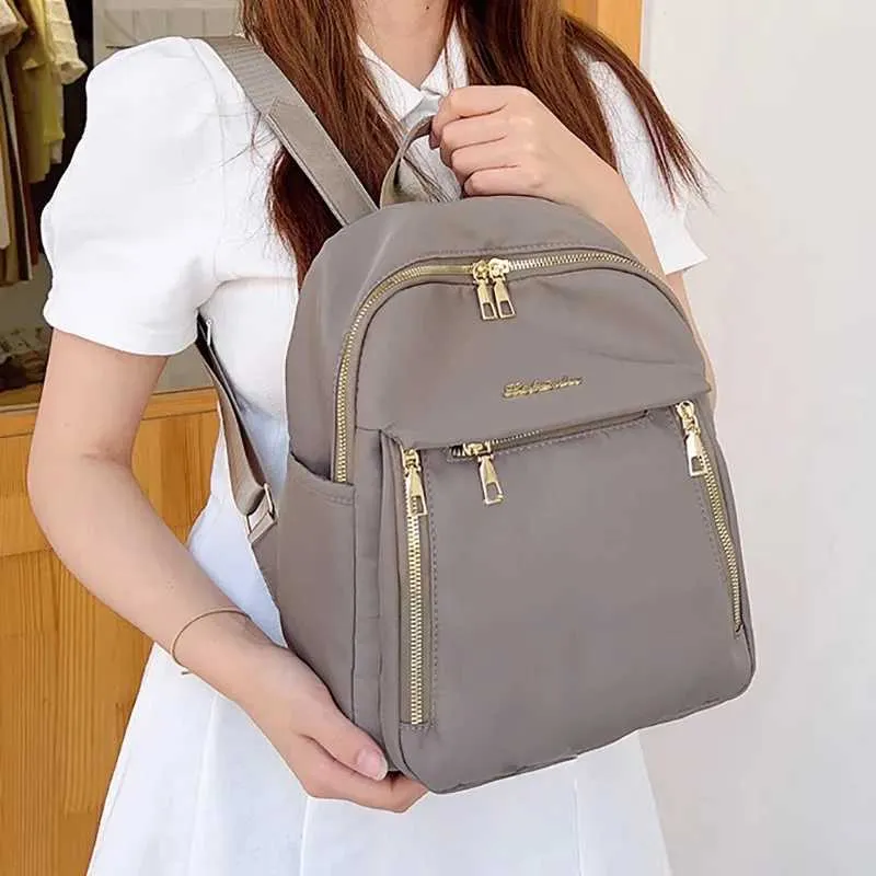 Sac à dos tendance en nylon imperméable à fermeture éclair de grande capacité avec filetage 2024 Hot Selg Sac polyvalent pour femme Mochila Mujer Y241116_voghion.com