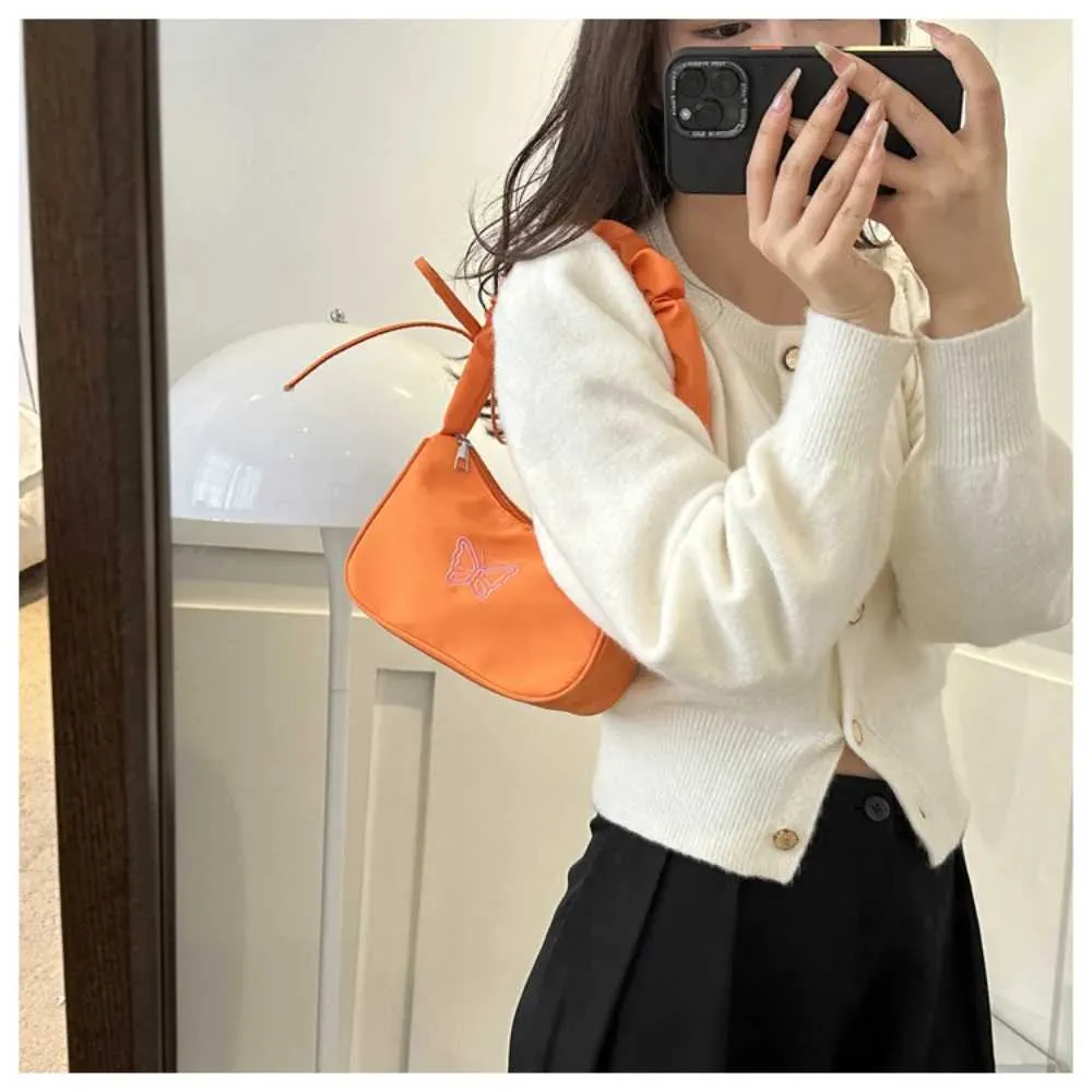 Tikand Bowknot Shoder Bag Y2k stiilis volangidega käepide Nyl Bow meigipulga kott käekott Y241026_voghion.com