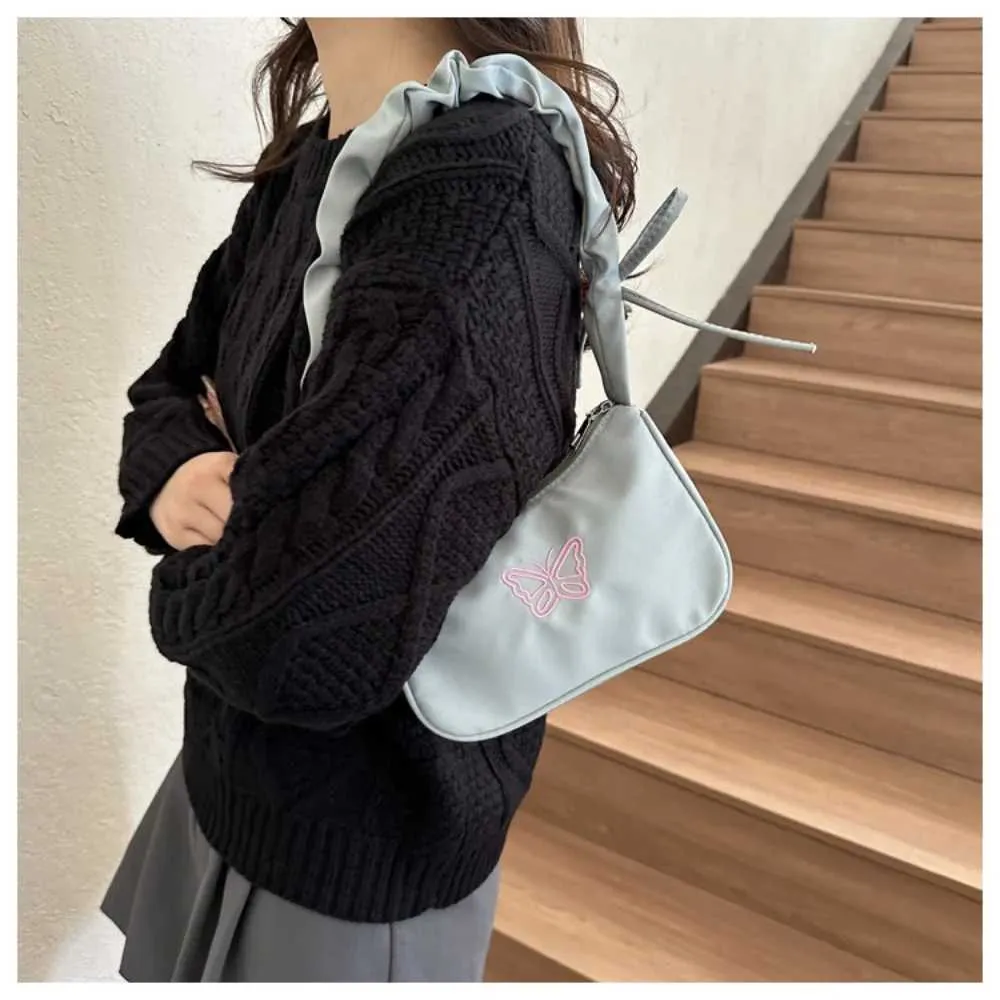 Tikand Bowknot Shoder Bag Y2k stiilis volangidega käepide Nyl Bow meigipulga kott käekott Y241026_voghion.com