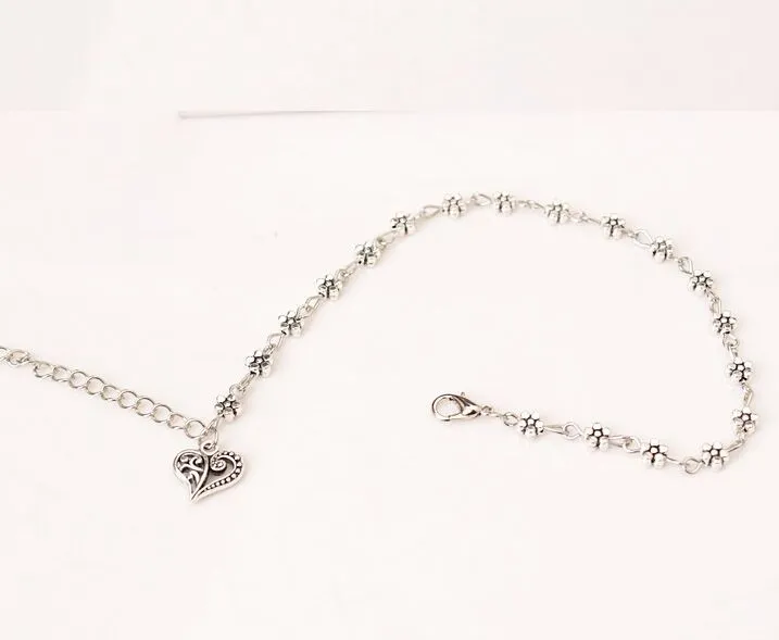 12 pezzi/lotto, ornamenti per i piedi in argento cavo tibetano retrò, a forma di cuore color pesca, con fiori di prugna._voghion.com