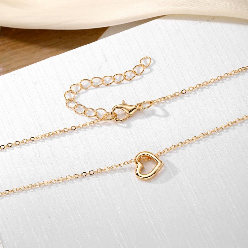 Liebesanhänger Halskette für Frauen hohler Stil hochwertiger Sinn für alle Spielpullover Schlüsselbeinkette Schmuck_voghion.com