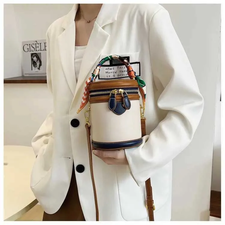 Borsa a secchiello in tela beige borsa a tracolla e a mano_voghion.com