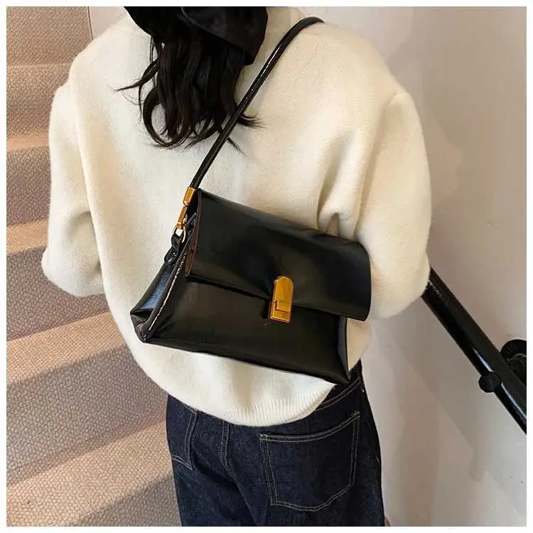 Strukturerad axelremsväska och crossbody väska för damer_voghion.com